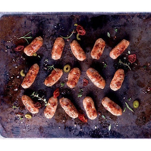 Small sausages with herbs, green olives and preserved tomatoes main product photo