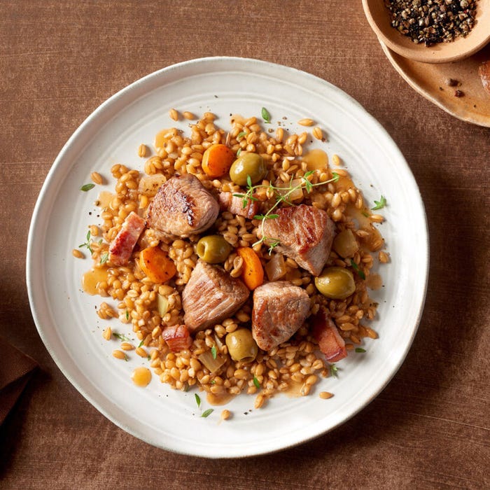 Veal stew with spelt and olives main product photo